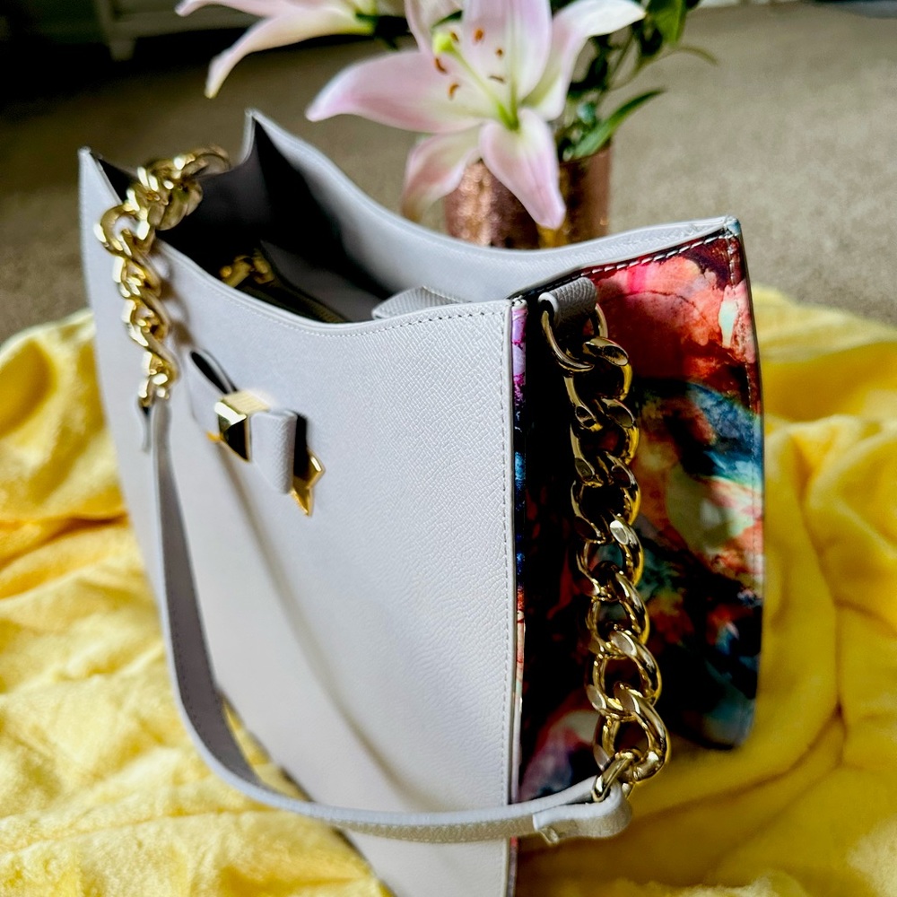 Betsy saffiano textured leather shoulder bag that features glamorous gold-tone